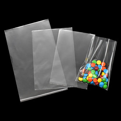 100pcs прозрачни пластмасови торбички бонбони бонбони бонбони бисквитки Опаковката ясна опп целофанова чанта коледен подарък за сватбен рожден ден парти